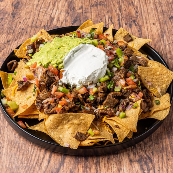 La Champa Latin Grill's Honduran nachos with steak, guacamole, sour cream, and pico de gallo.