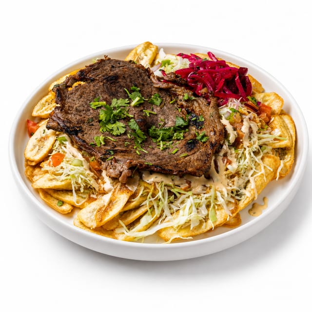 Carne Asada Plate withTajadas & Cabbage Salad.